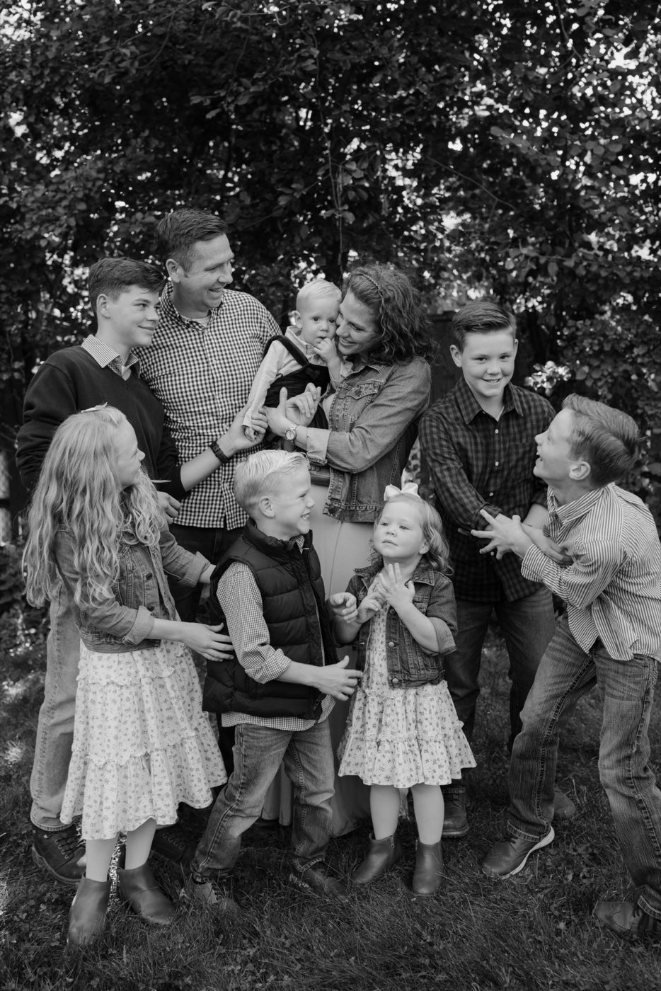 Pax Family's founder with his wife and seven children